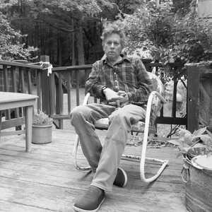 Black-and-white portrait of Raymond Foye