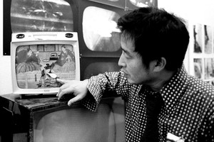 A portrait of Nam June Paik