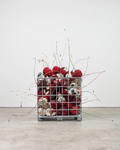 Kathleen Ryan, Bad Cherries, 2021. Amazonite, aventurine, fluorite, turquoise, malachite, angelite, labradorite, smoky quartz, quartz, rose quartz, citrine, magnesite, aquamarine, green line jasper, sesame jasper, pink aventurine, agate, tiger eye, garnet, carnelian, lapis lazuli, moonstone, mother of pearl, shell, freshwater pearls, wood, acrylic, glass, steel pins on coated polystyrene, fishing poles, lead sinkers, and steel pallet cage, 98 ½ × 100 × 110 ½ inches (250.2 × 254 × 280.7 cm) © Kathleen Ryan. Photo: Lance Brewer