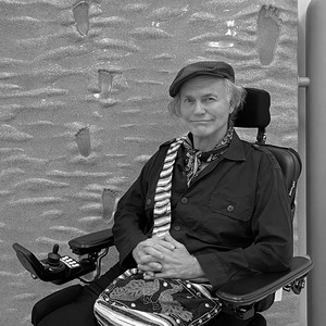 A portrait photograph of Ashley Bickerton