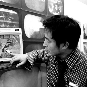 A portrait photograph of Nam June Paik