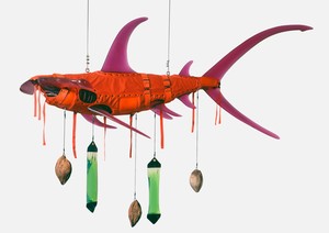 Ashley Bickerton, Orange Shark, 2008. Polyurethane resin, nylon, cotton webbing, stainless steel, mouthwash, distilled water, coconuts, and rope, 60 × 116 × 42 inches (152.4 × 294.6 × 106.7 cm) © Ashley Bickerton
